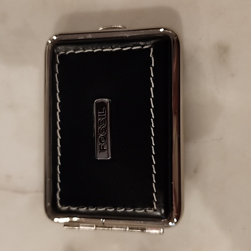 Leather pill box for handbag or pocket.